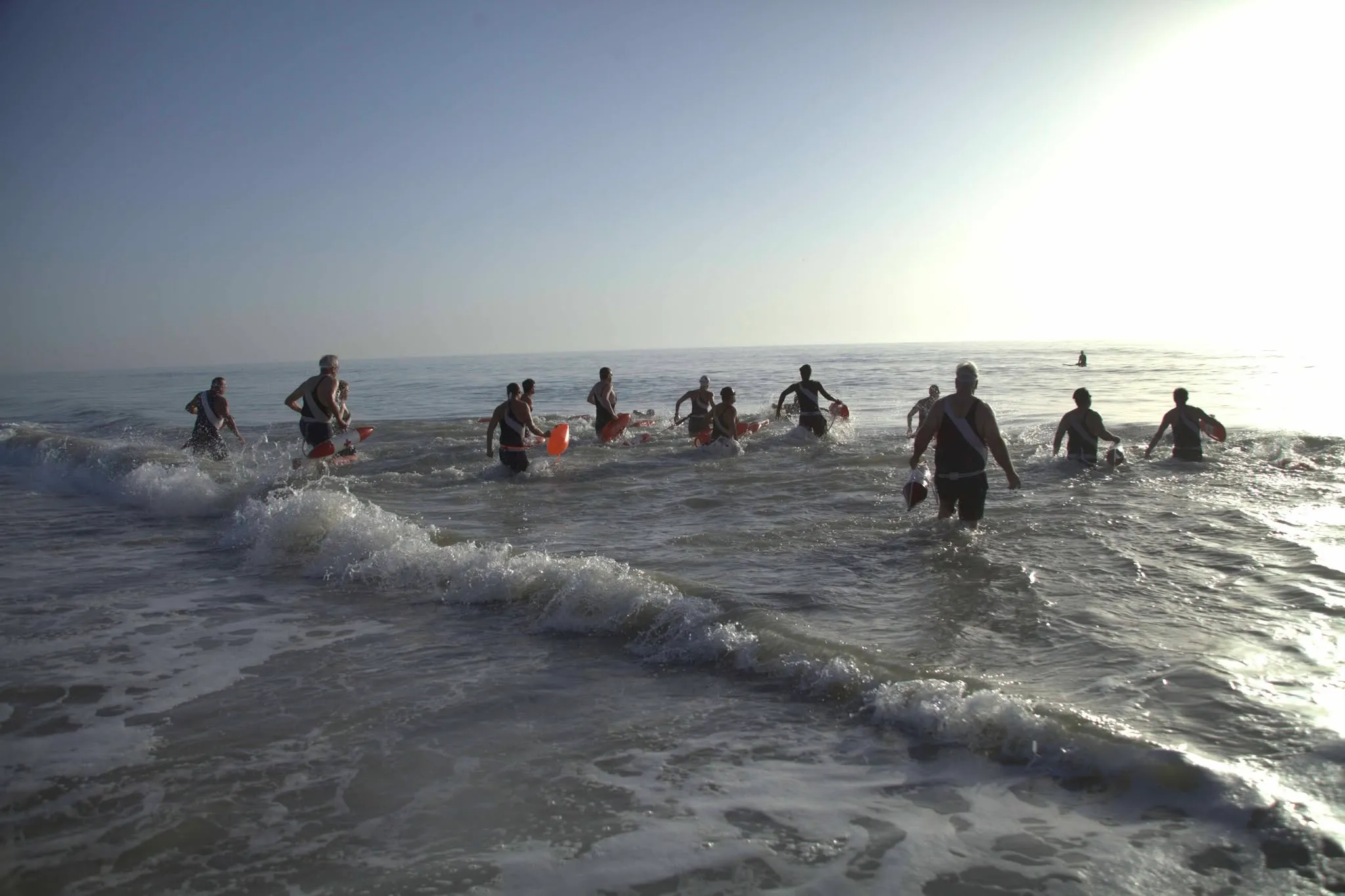 Meninak Ocean Marathon swimmers entering the water